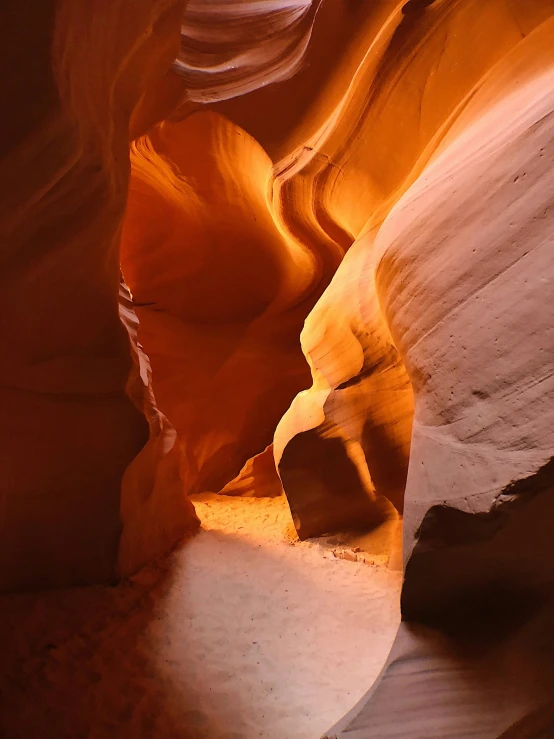 sunlight falls through the canyons, creating a narrow corridor