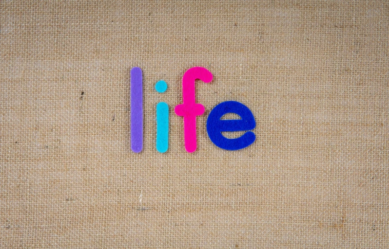 a picture of colorful plastic letters on a fabric