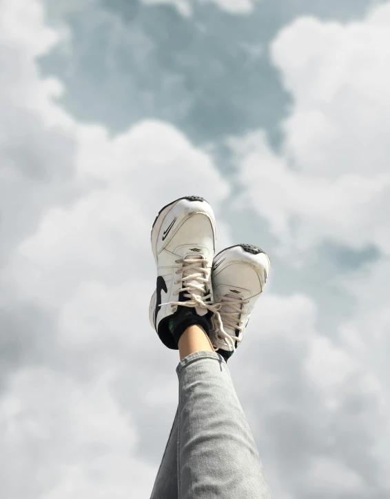 a person standing with their feet up on their shoes