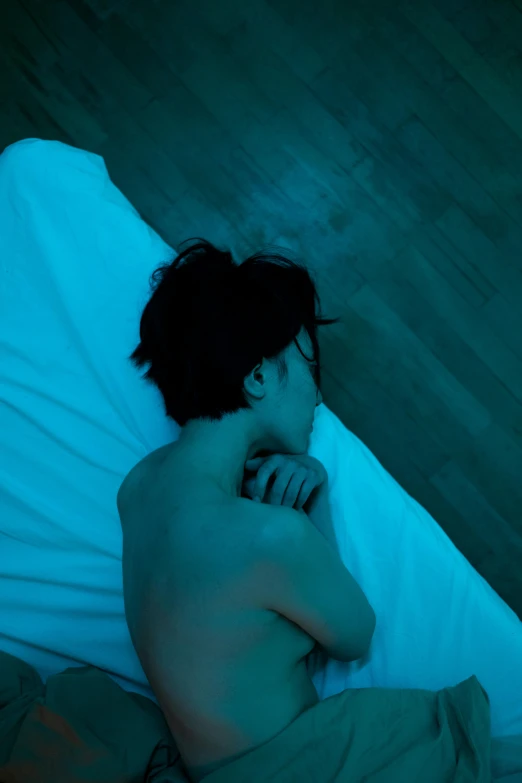 an image of a man asleep in the bed