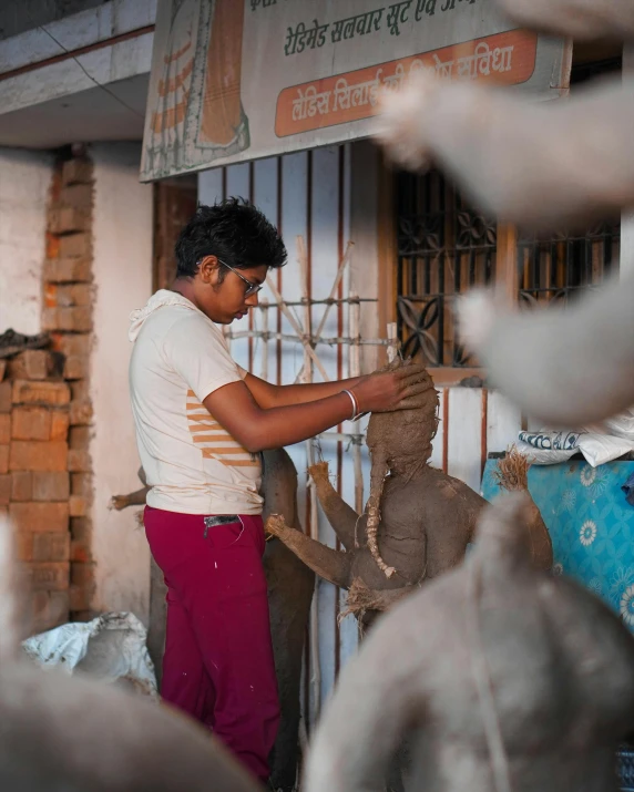 a man is putting an animal into it's bucket