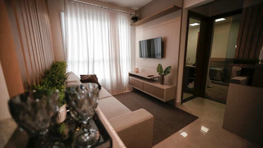 a clean and orderly living area with champagne in glasses