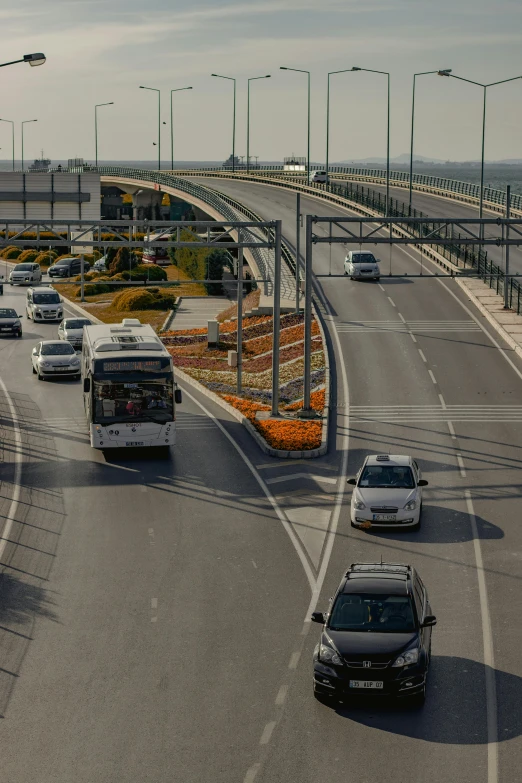 the road is lined with cars, trucks and other vehicles