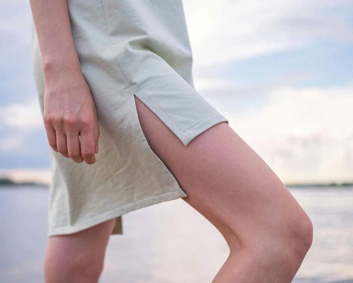 a close up of a person walking on the beach