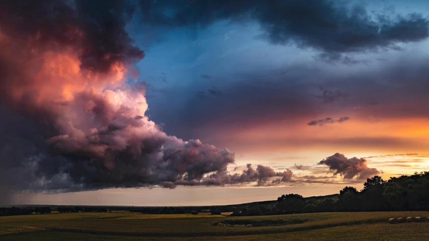 large clouds at sunset above the country