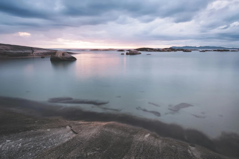 a body of water with some rocks in it