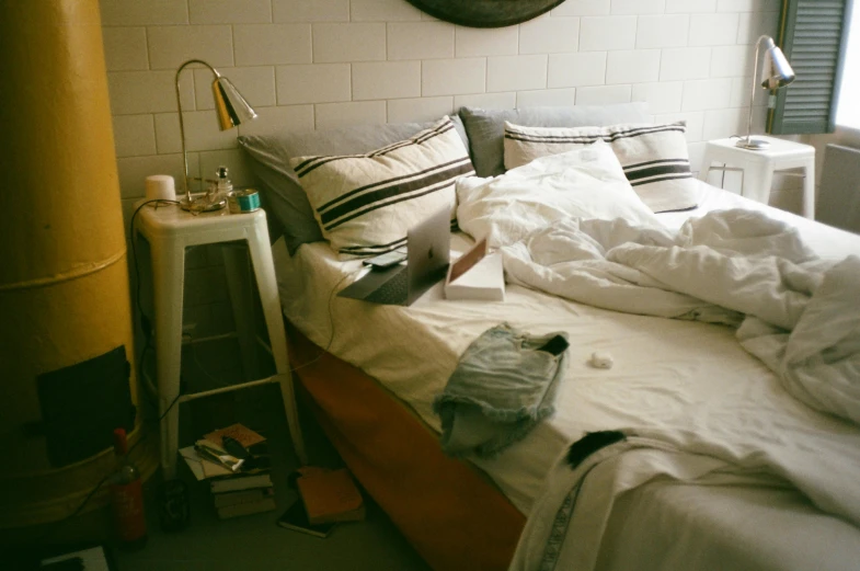 a bed sitting in a bedroom under a window