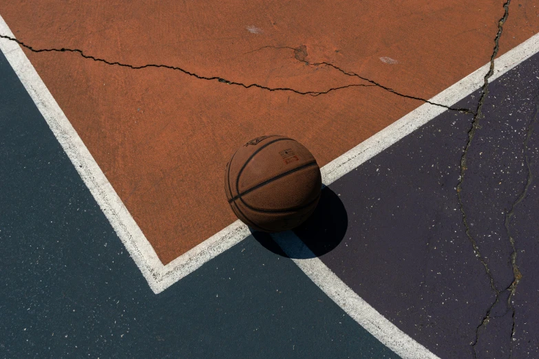 a close up of a basketball on the tennis court