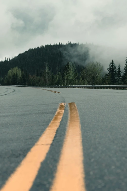 an empty road is in the middle of a highway