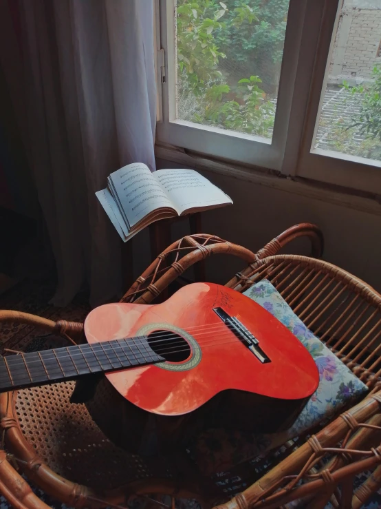 a guitar on a basket in a room