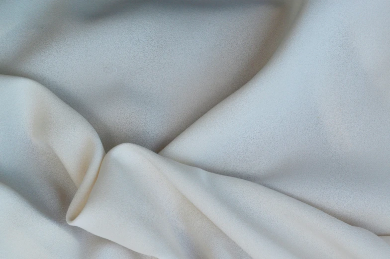 a close up view of an off white cloth