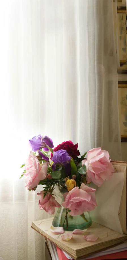 a large bouquet of flowers sitting on top of a wooden table