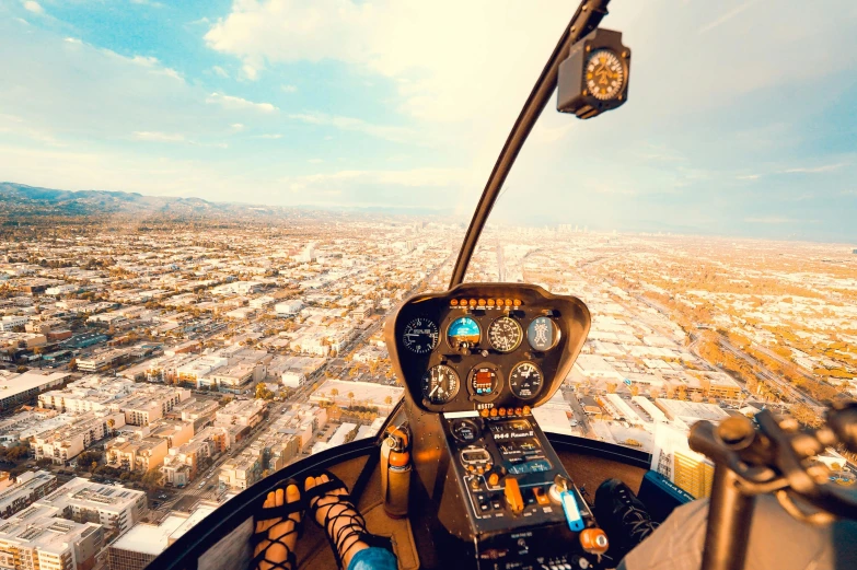 the inside view of an airplane cockpit showing a city