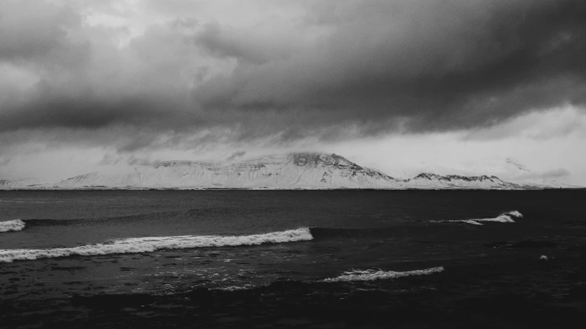 a very pretty black and white picture with some very large clouds