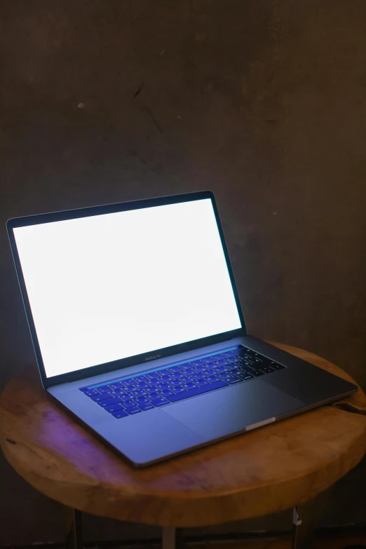 the laptop computer has been turned on to show a white screen