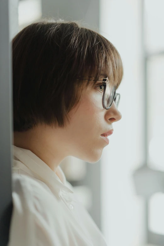 a young person standing with some kind of glasses