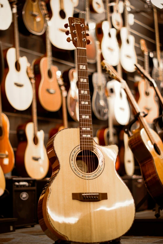 guitars and musical instruments on display in a store