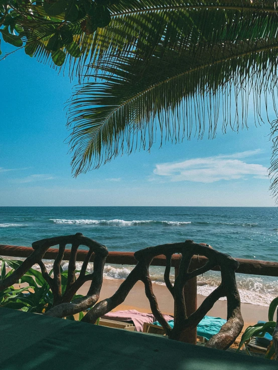 benches and chairs are set up overlooking the ocean