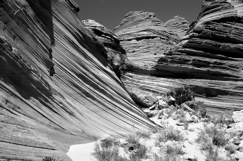 black and white pograph of rock formations in an open area