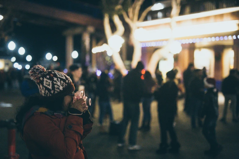 the background is blurry from a po of a crowd at night