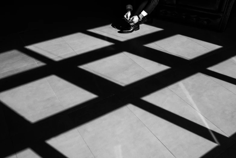 black and white pograph of a person with skateboard