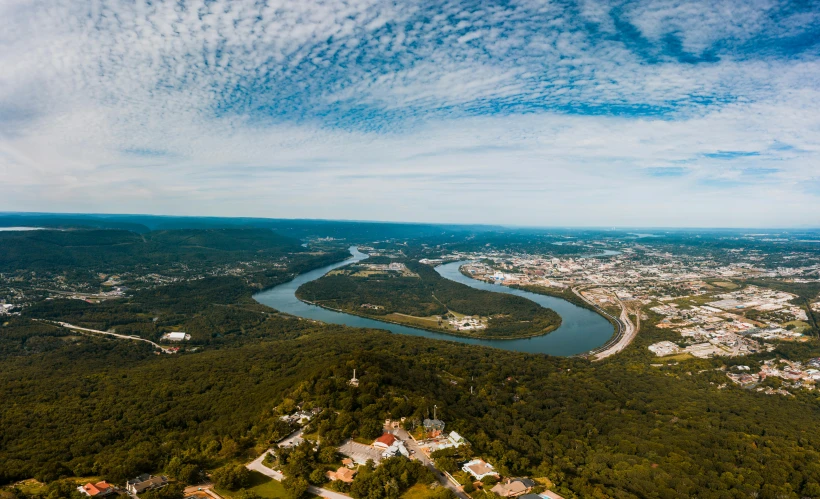 an aerial view of a river and a city