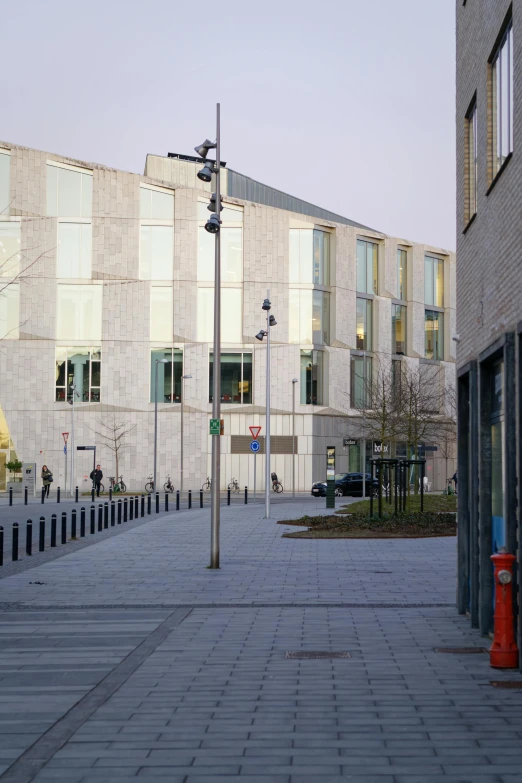 view of city with building in the distance from empty plaza