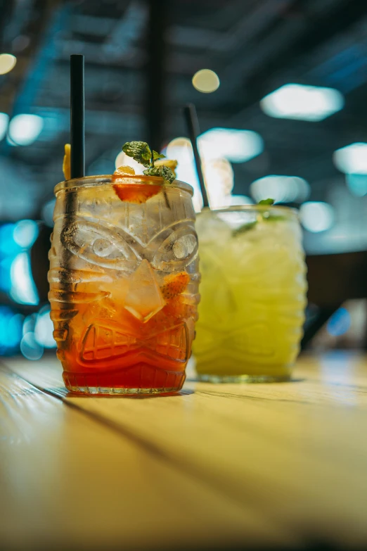 three drinks sitting on a table in front of each other