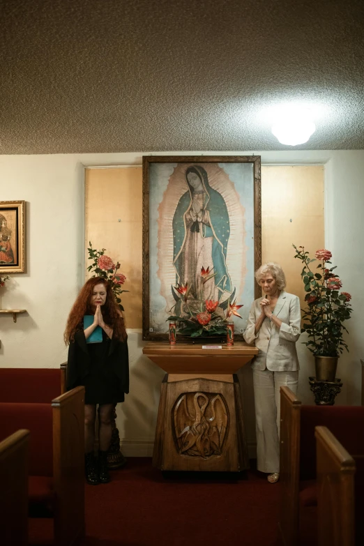 two women in a church standing next to each other