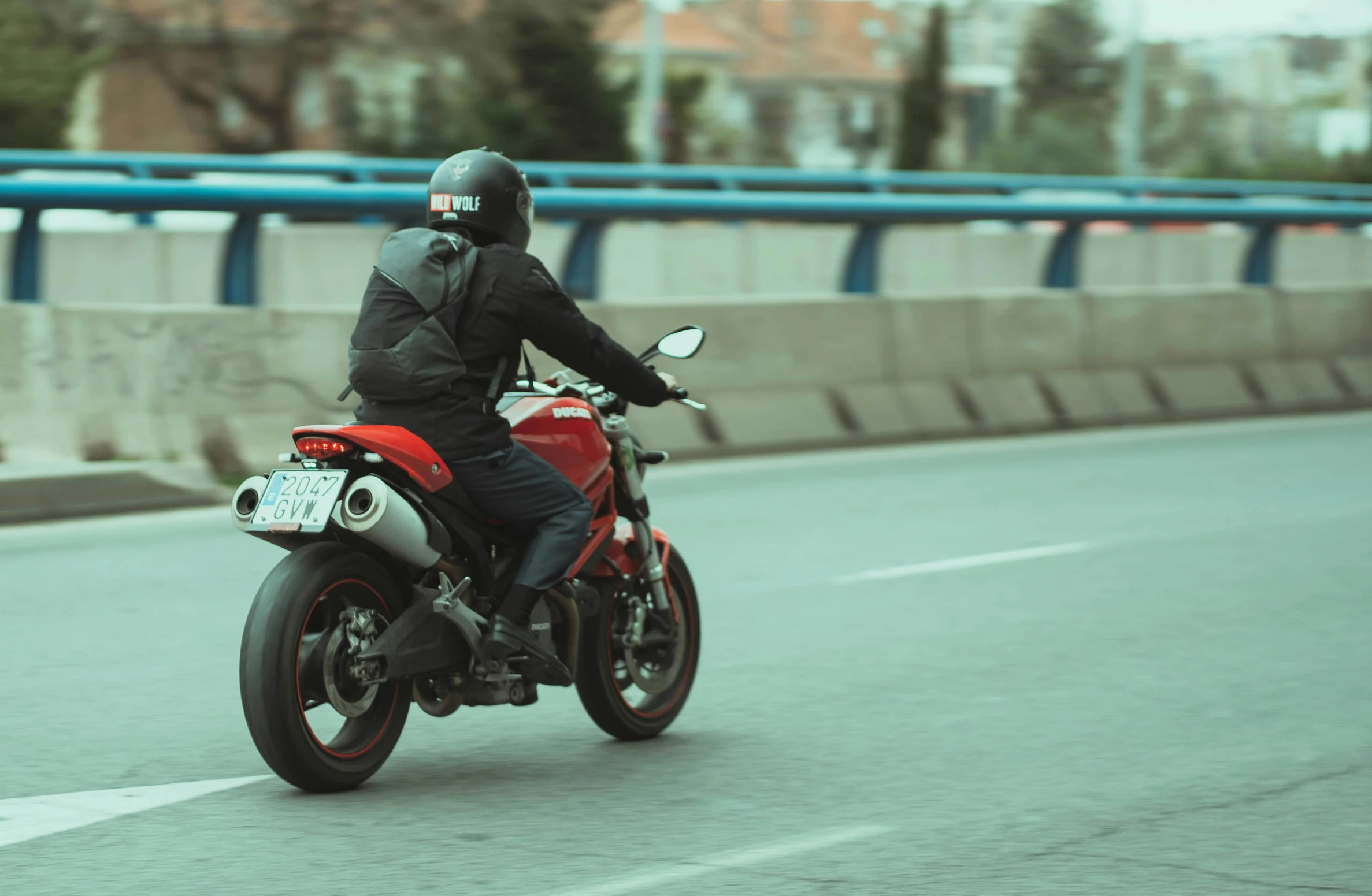 a man riding a motorcycle on the street