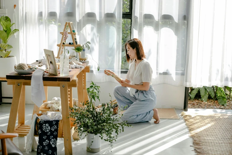 a person that is sitting down with flowers