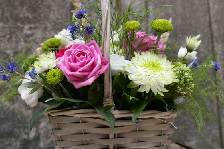 a bouquet of flowers in a basket