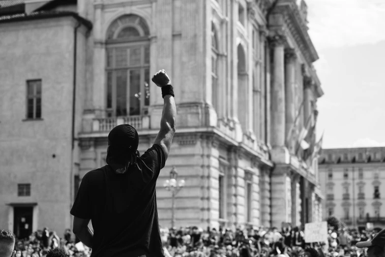 a man is holding up his bird in the air