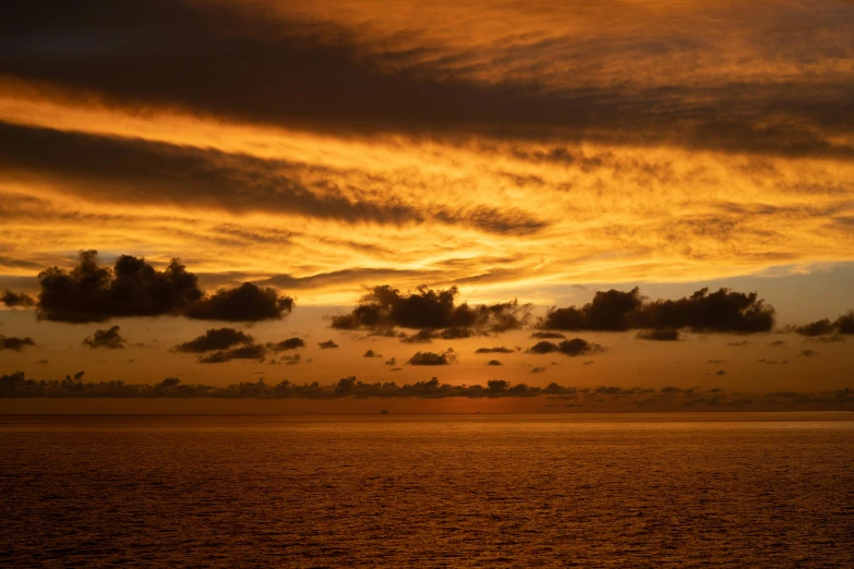 a boat sails by at dusk on the water