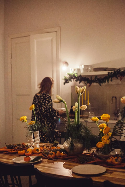 woman preparing food at the table in a kitchen