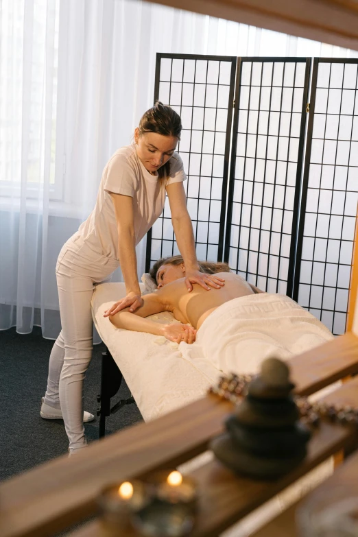 a woman having massage in a luxurious spa