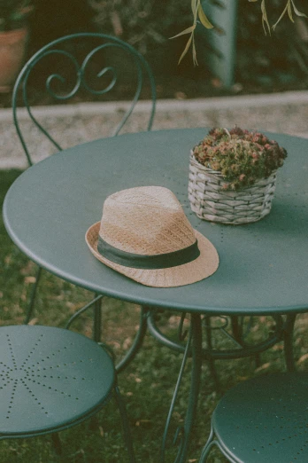 a hat on top of a table and chair