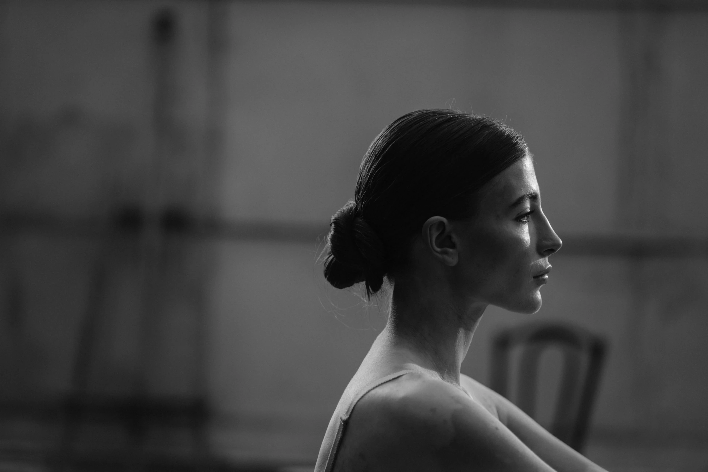 a woman in a ponytail sitting down