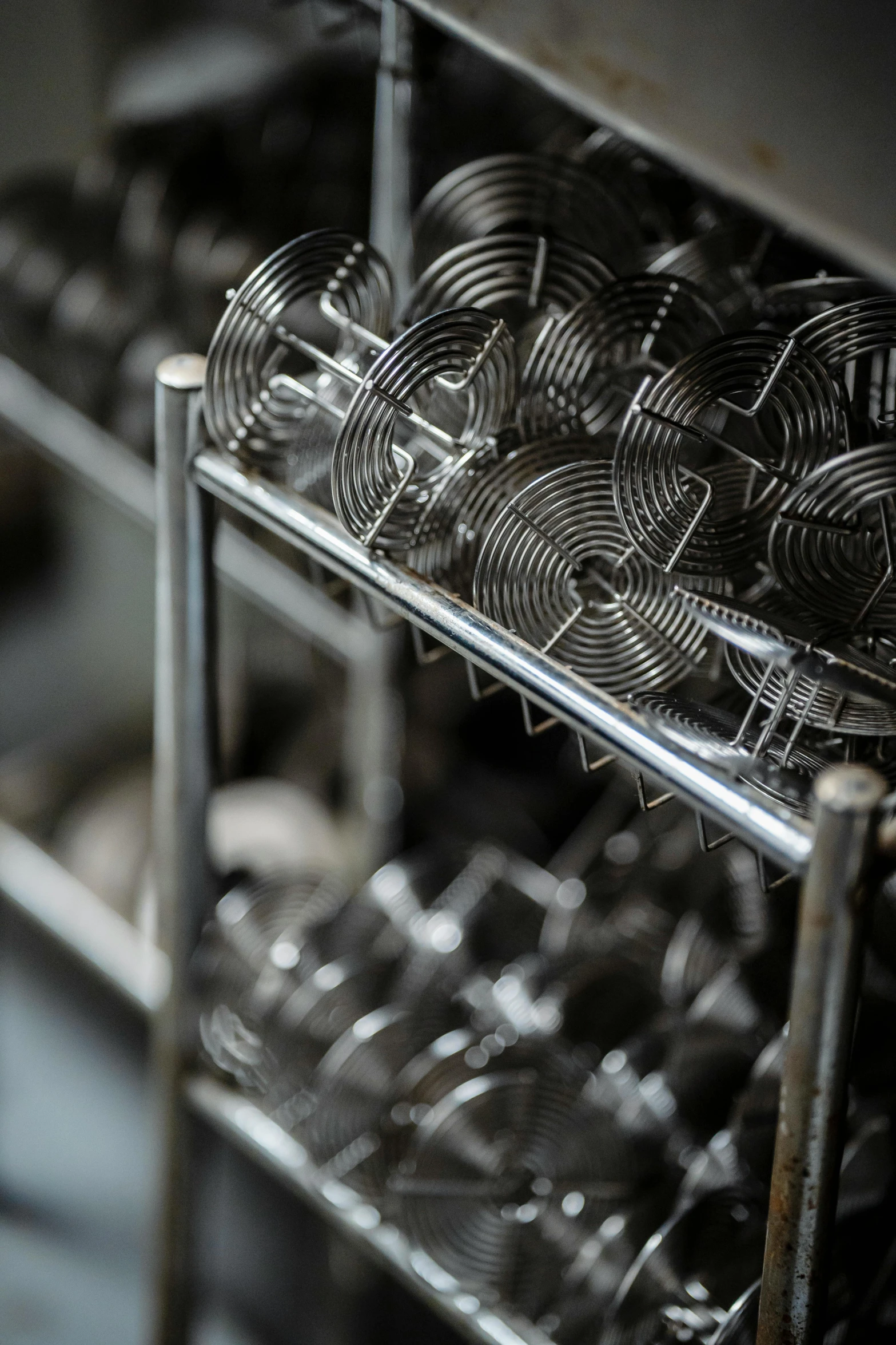 wine glasses that are stacked on the rack