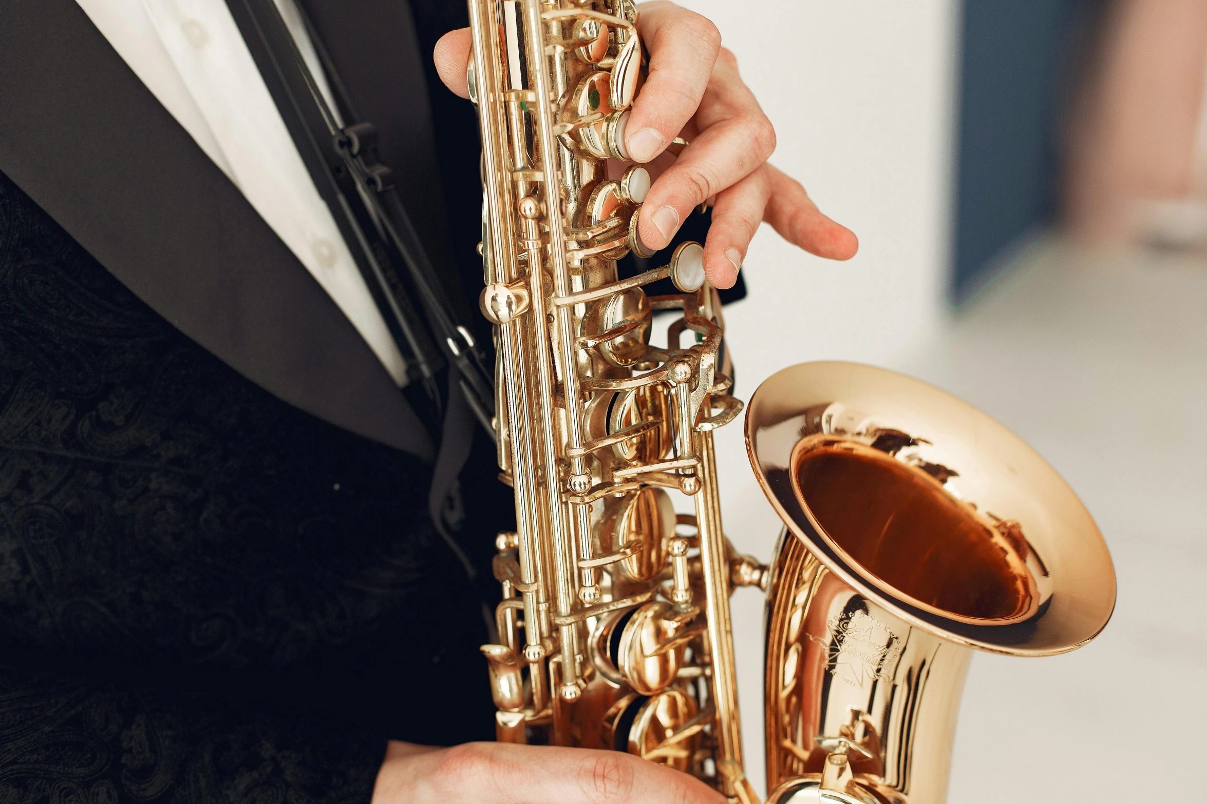 a close up view of someone playing on a saxophone