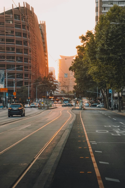 there are several cars driving in the street