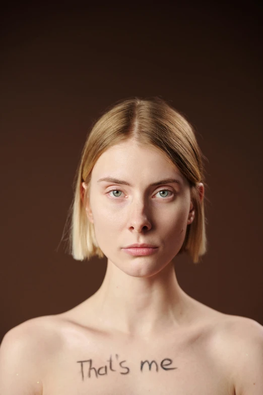 woman with short blonde hair wearing  with words on chest