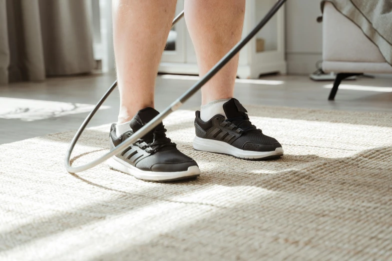 a person using a high pressure floor cleaner