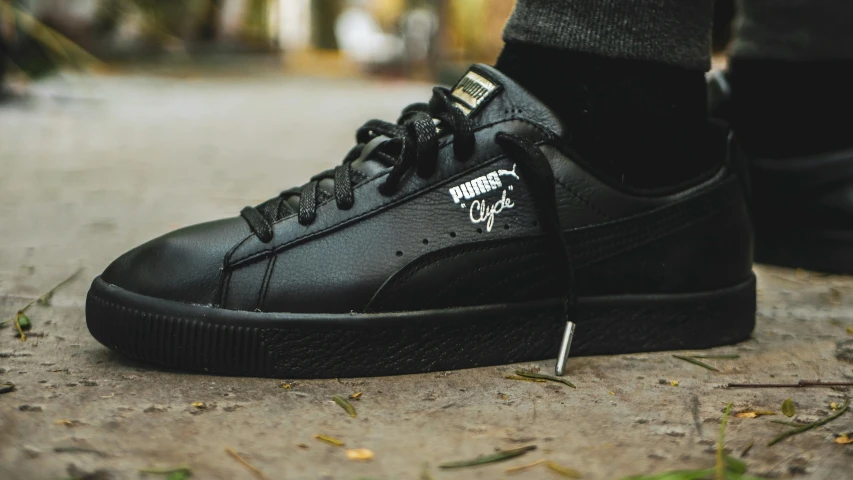 the puma suede is worn with black sued
