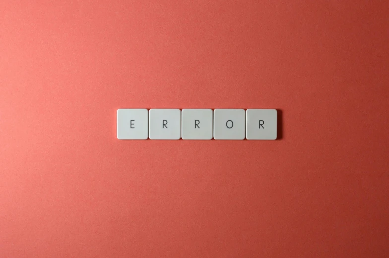 the word error is spelled on a paper cube