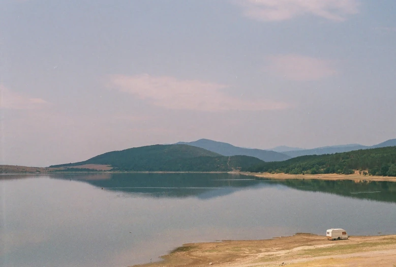 a po of mountains and water in the distance