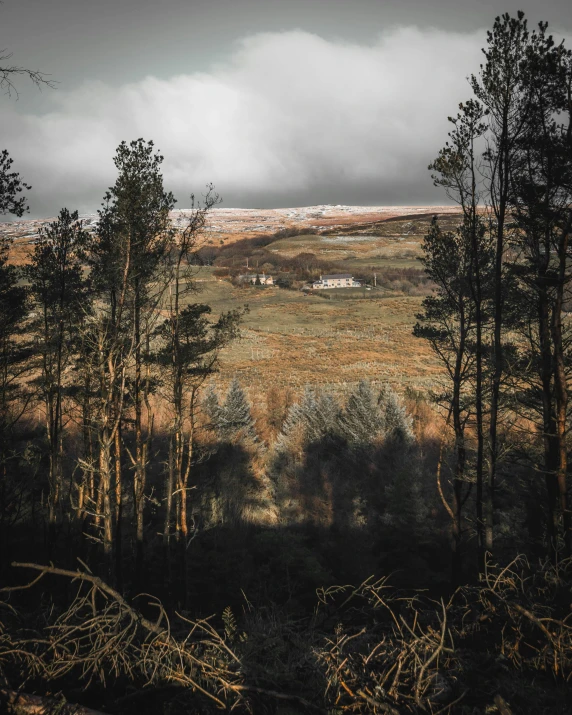 there is an image of a hill with a farm