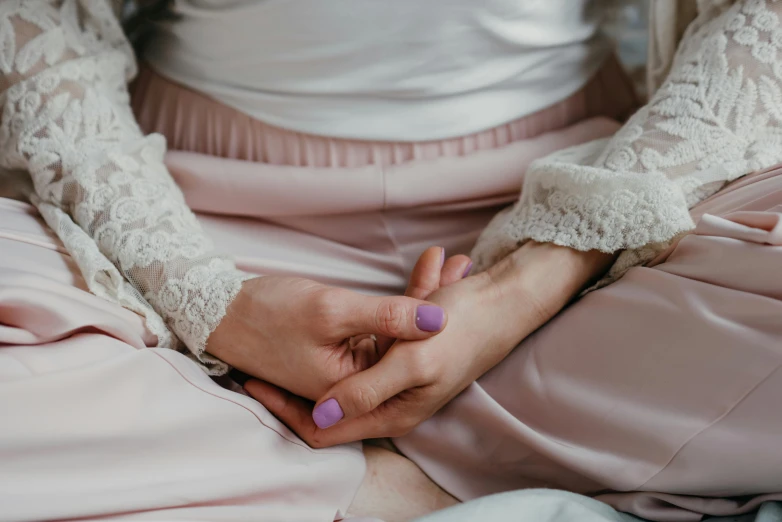 a woman in white jacket and pink pants