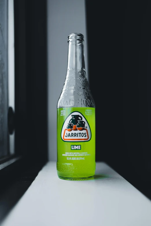 a bottle of liquor sitting on top of a white counter