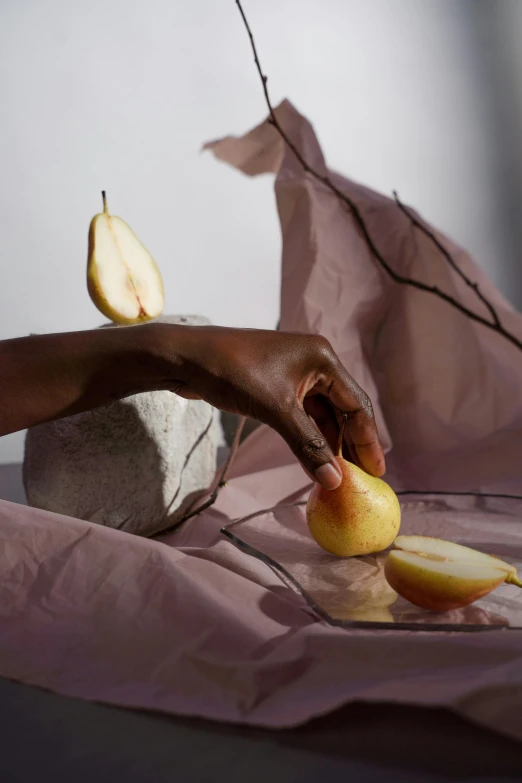 a person slicing apples and putting them in the bowl